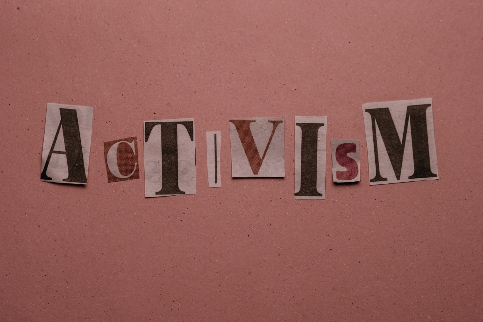 The word activism spelled in cut-out newspaper letters